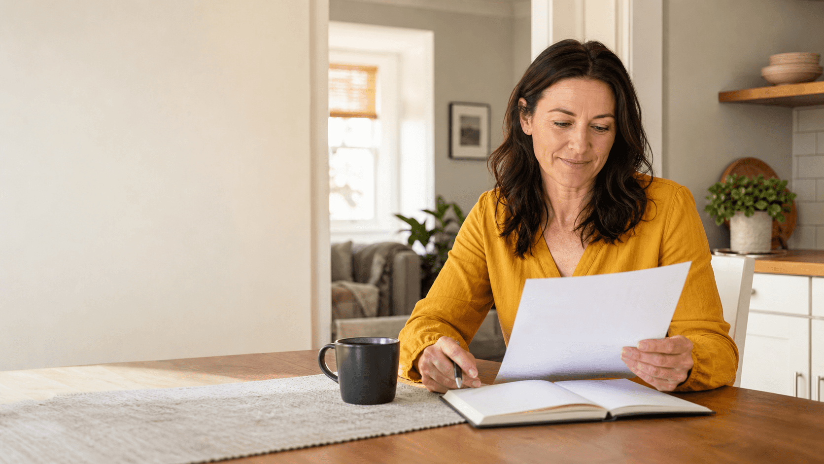 A homeowner calmly reviewing property information at a kitchen table